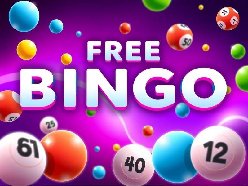 Woman playing online bingo on laptop and mobile phone